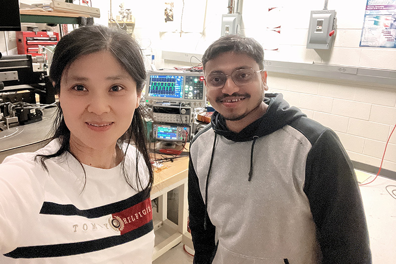 Yuping Zeng and postdoctoral researcher Chandan Samanta in the laboratory testing ferroelectric field-effect transistors. Courtesy of Yuping Zeng.
